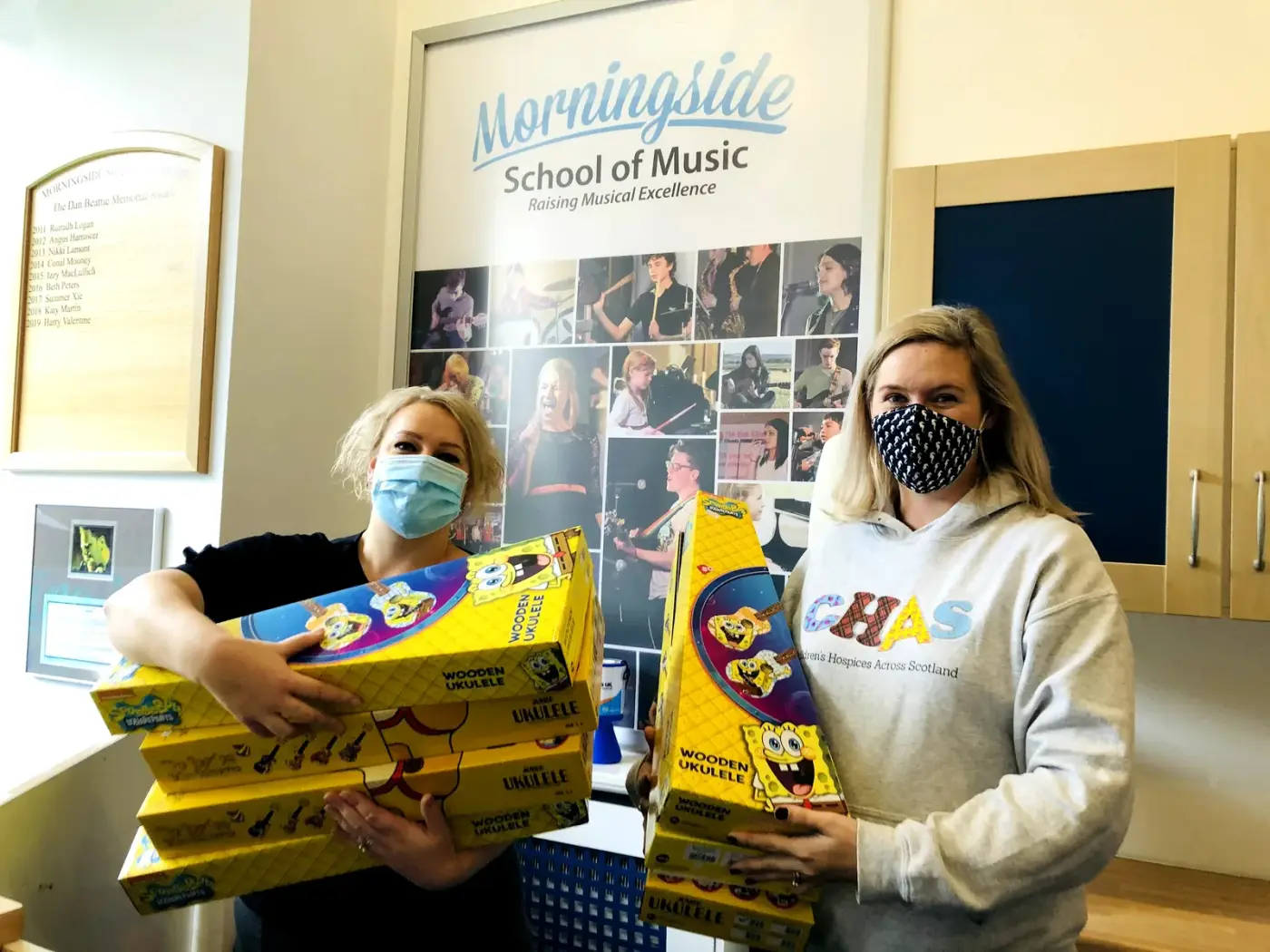 Morningside School of Music staff donating ukuleles to CHAS, Children's Hospices Across Scotland