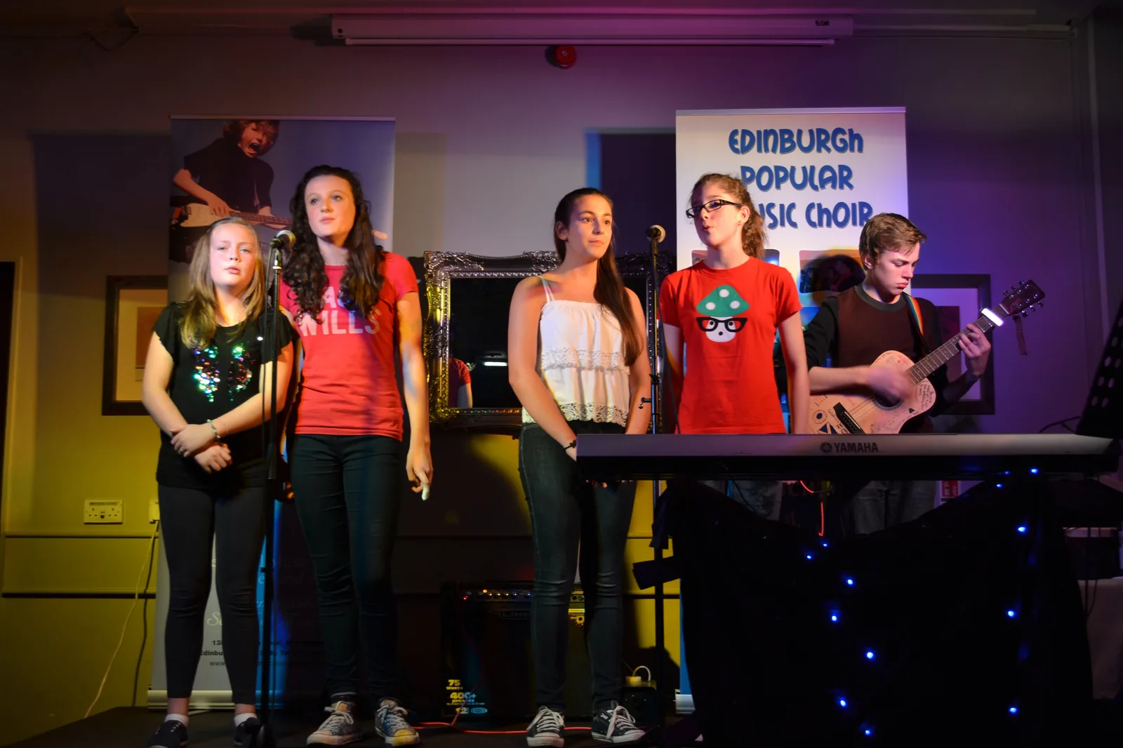 Students performing with the Edinburgh Popular Music Choir at a Morningside School of Music charity event