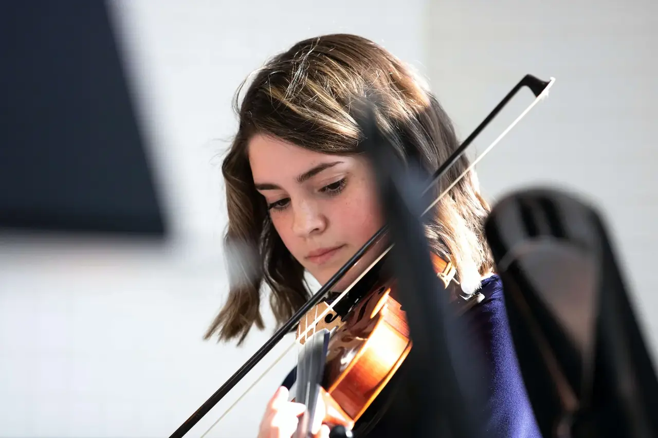 A Morningside student in a violin lesson